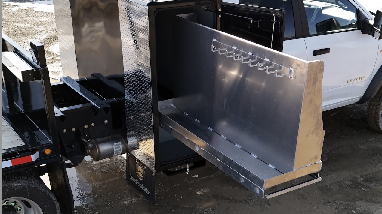 Wrench hangers visible in divided cabinet of oilfield RAM 5500 deck by Core Fabrication