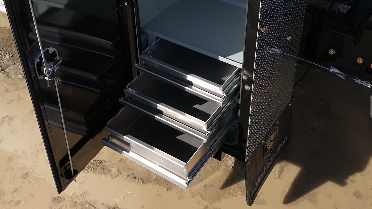 Aluminum drawer sets visible in cabinet of oilfield RAM 5500 deck by Core Fabrication